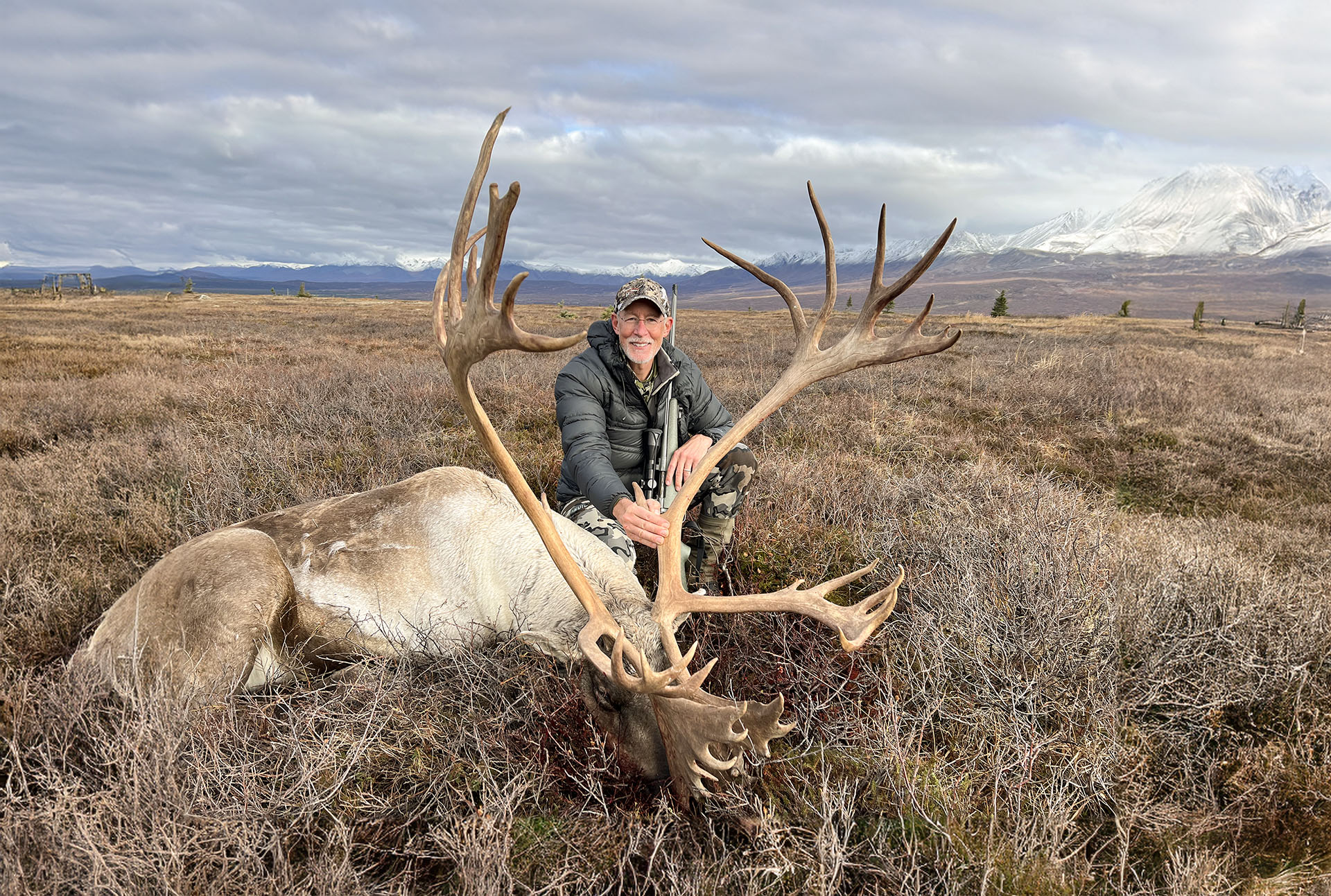 hunter with caribou in the fall